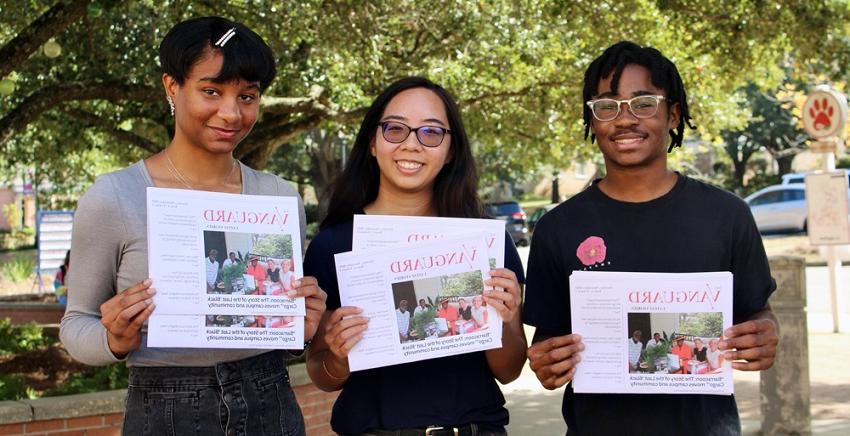 With print editions of The Vanguard student newspaper are, from left, Brandon Clark, managing editor; Stephanie Huynh, editor-in-chief; and Iman Thibodeaux, contributing writer.